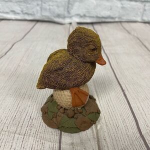 Vintage 1992 Duffy Tim Wolfe duck on a golf ball figurine 4x3